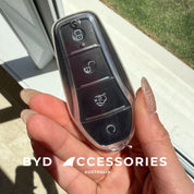 Hand holding a car key fob with 'BYD Accessories Australia' branding.