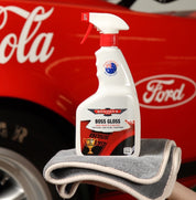 Bowser's Boss Gloss car care product on a gray towel with a red Ford vehicle in the background